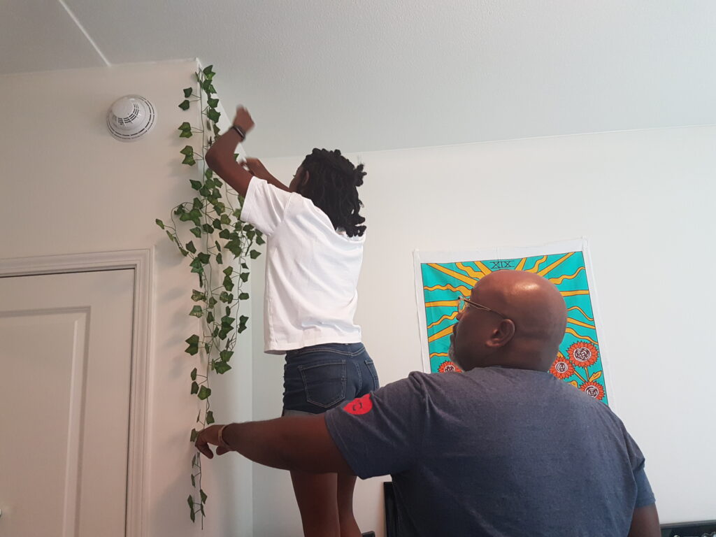 Our youngest daughter deciding she's a better interior designer than Kevin, and taking over decoration duties.