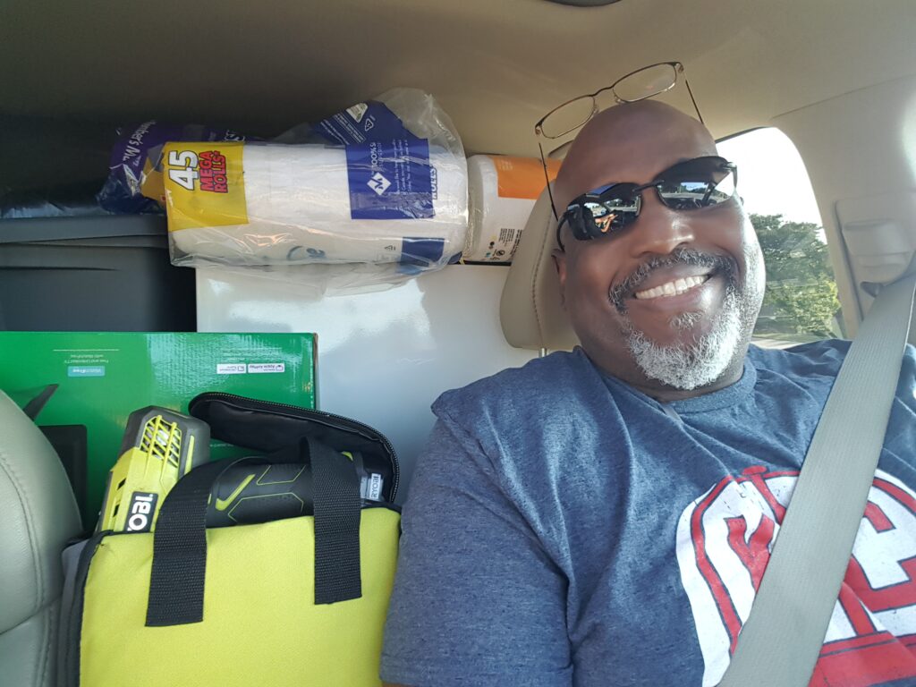 Kevin driving a car loaded with our youngest daughter's necessities for college life.